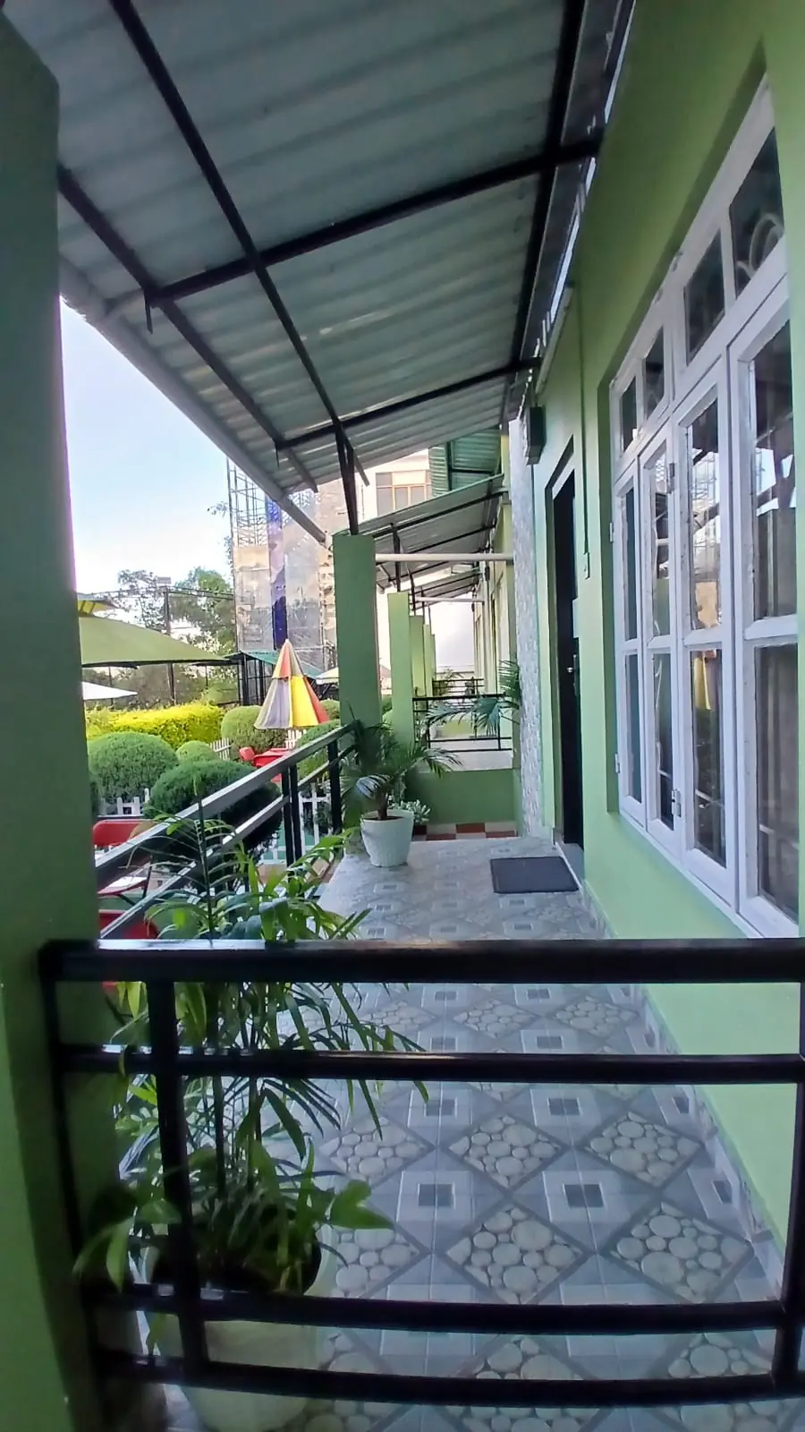 Private balcony of the Garden Cottage with potted plants