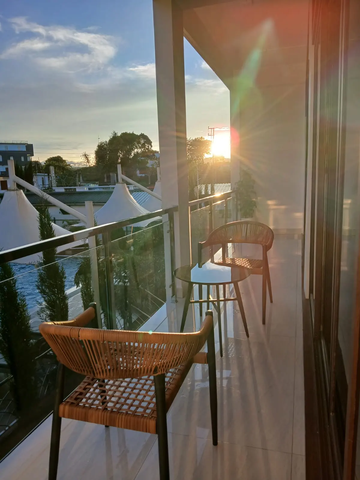 Grand Pool View Suite balcony with glass railing