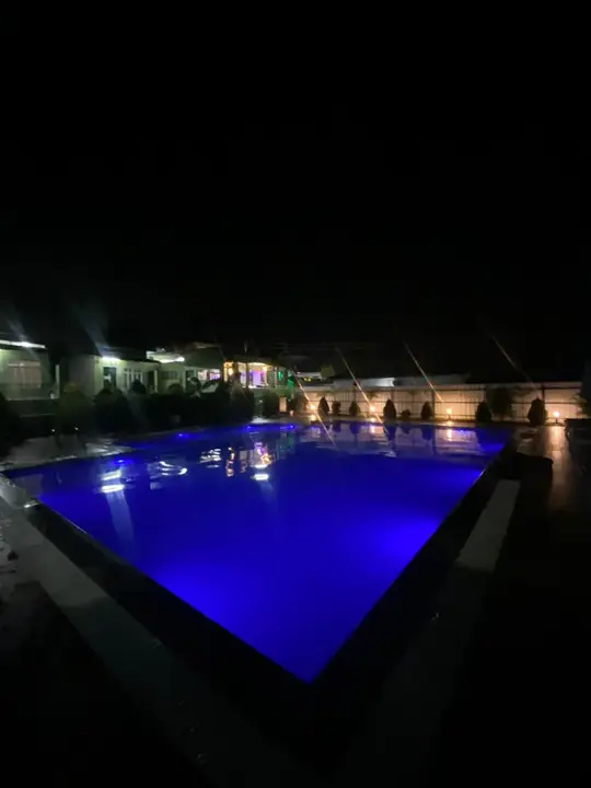 The pool lit up at night