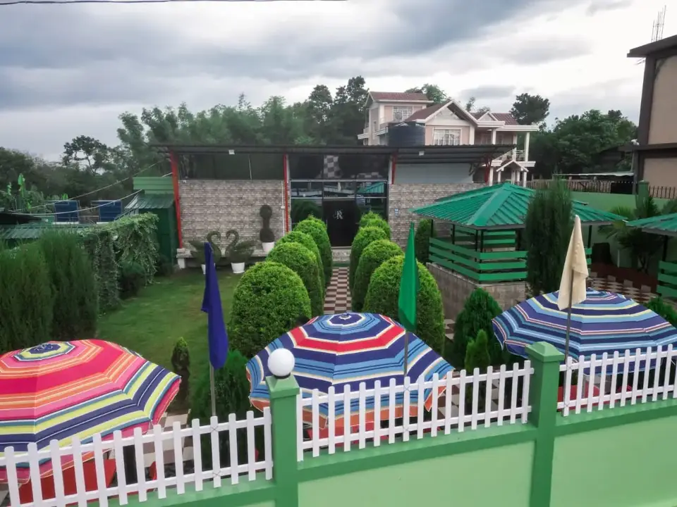 Garden dining under colourful umbrellas